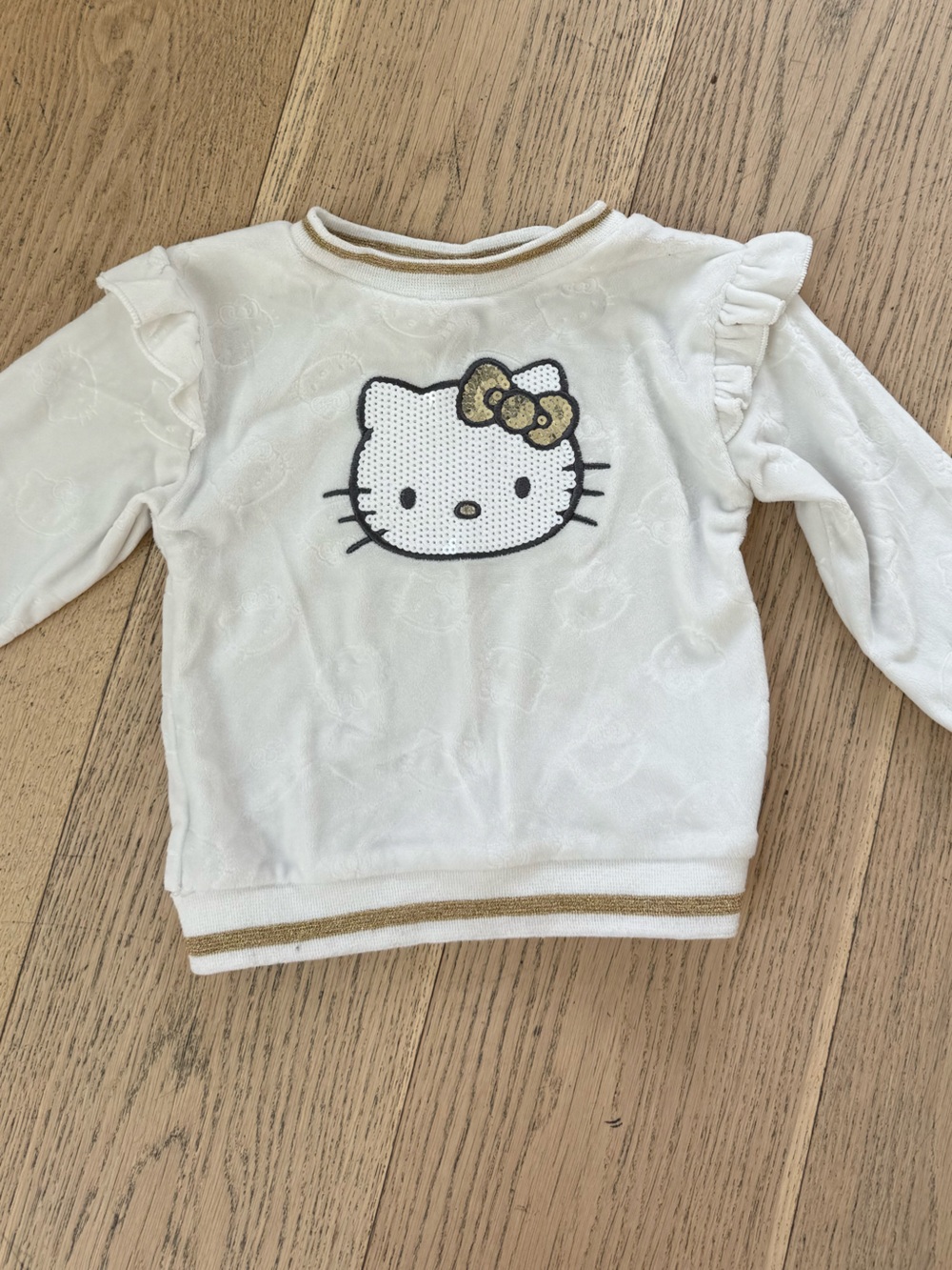 Hello Kitty Cream Sweatshirt with Gold Sequin Bow